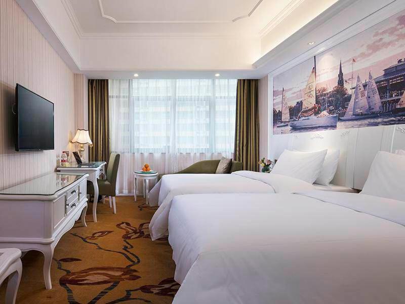 Vienna International Hotel Fenghua Zhongshan Road Bagian luar foto