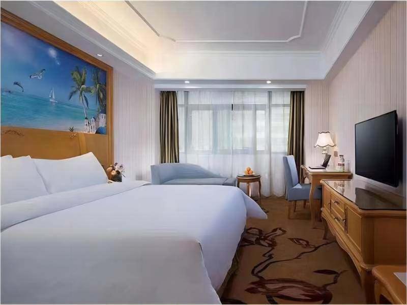 Vienna International Hotel Fenghua Zhongshan Road Bagian luar foto