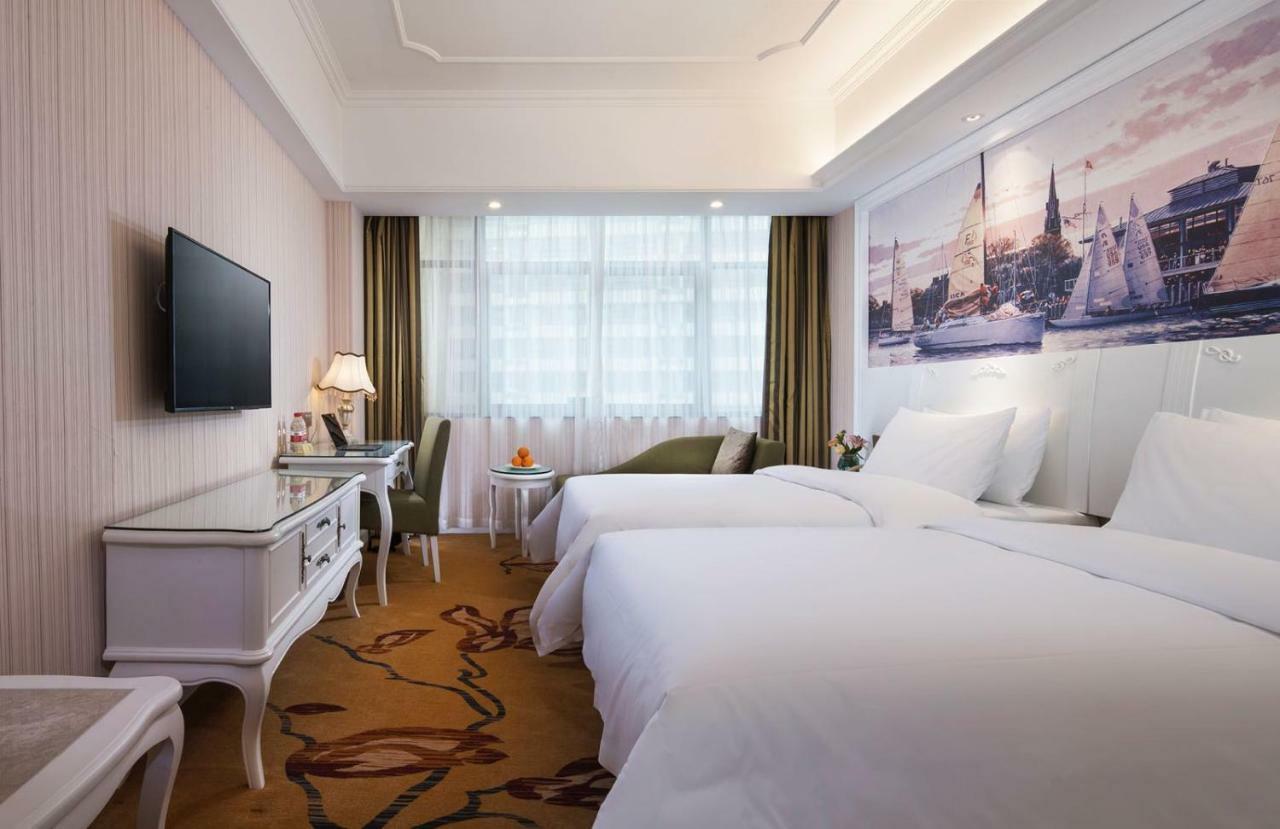 Vienna International Hotel Fenghua Zhongshan Road Bagian luar foto
